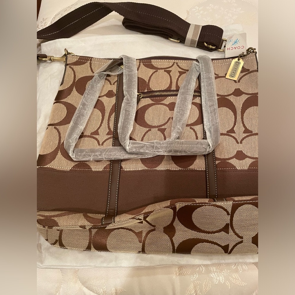 Brown “Coach” bag. Never been used. With tags. 16x14 inches.